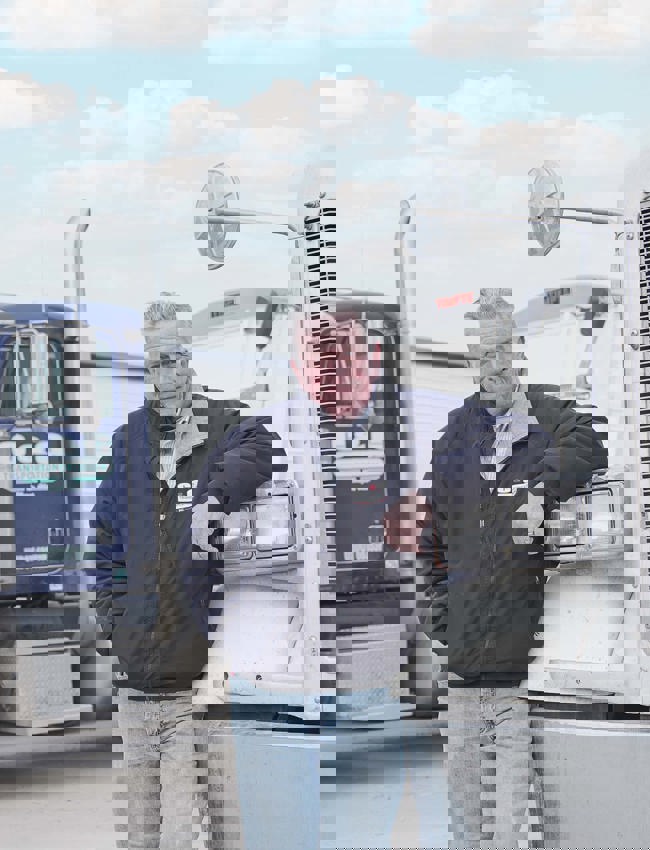 The Andersons customer standing with truck fleet