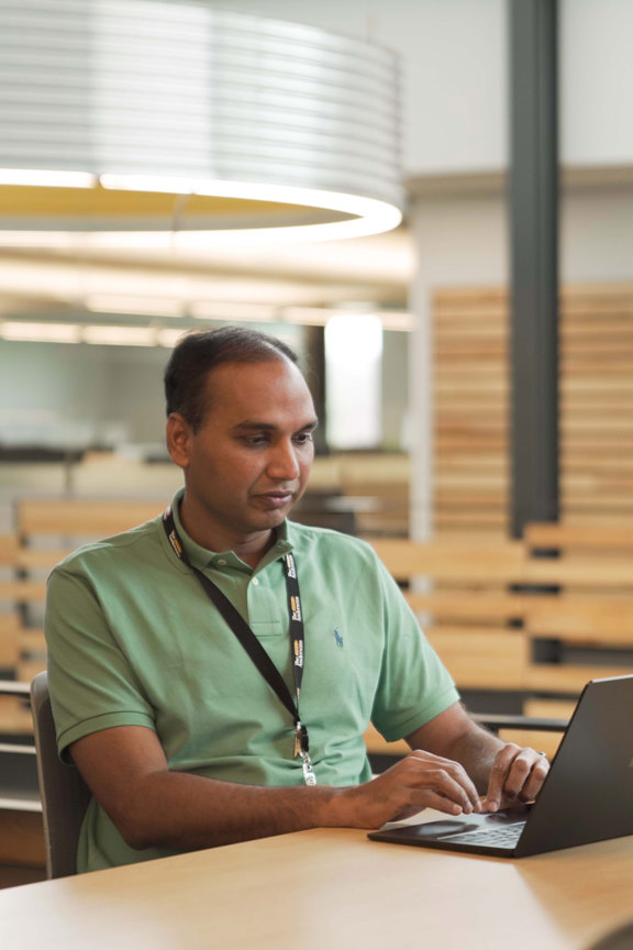 An individual from IT working on their laptop at The Andersons headquarters